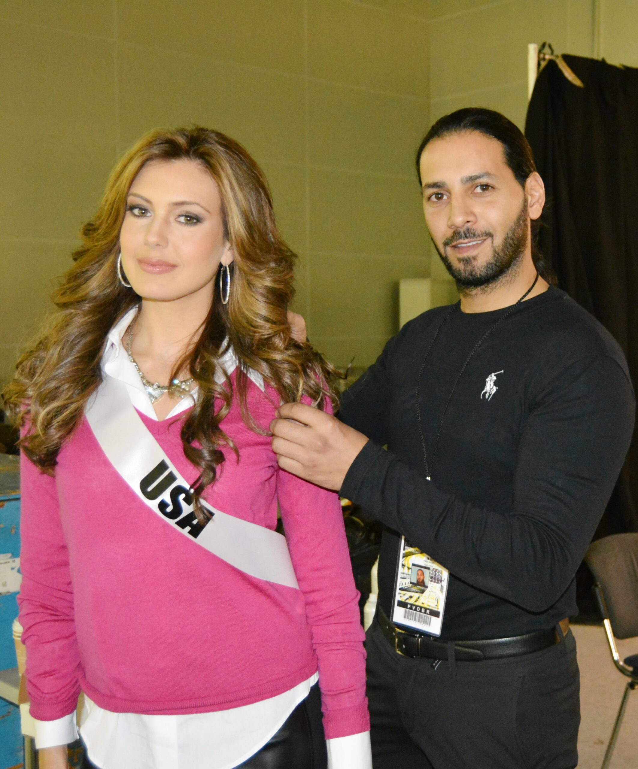 International hairstylist Fadi Nasr applying the final hair touches to Miss USA, a contestant in the Miss Universe competition.